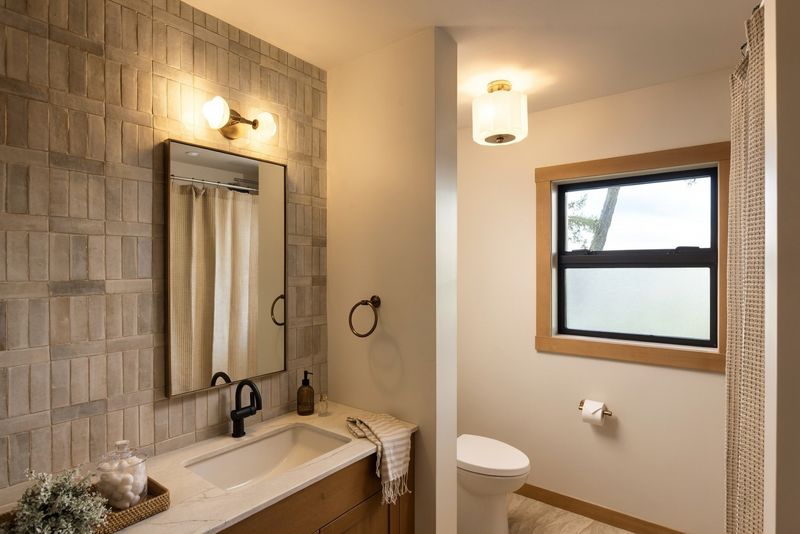 Renovated bathroom at BrightWoods with a window to the trees