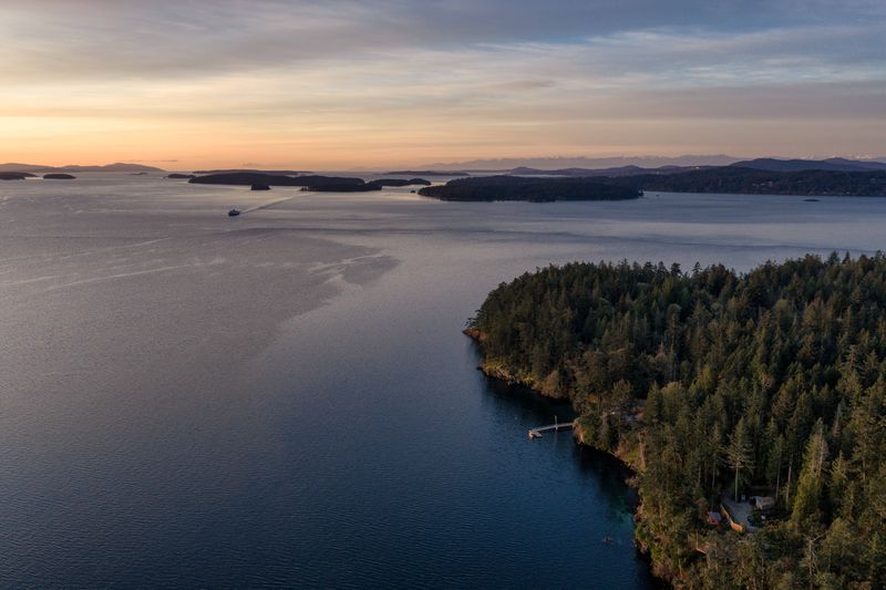 Aerial view over the water and islands near BrightWoods, Salt Spring Island