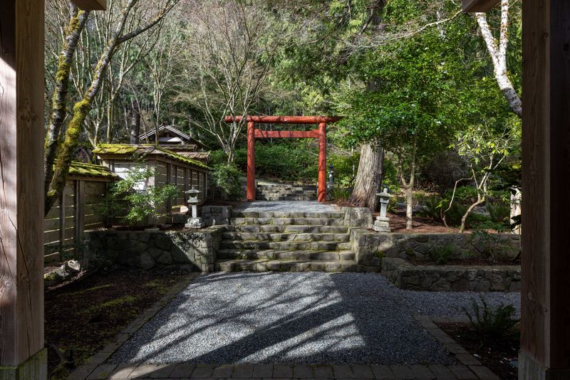 Japanese garden with a torii gate and stone steps at BrightWoods